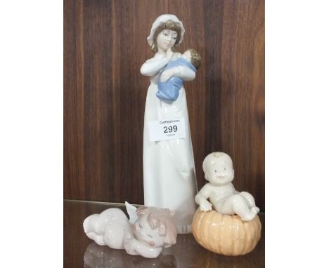TWO SMALL NAO&nbsp;FIGURES OF A BOY SAT ON A PUMPKIN AND A CHERUB TOGETHER WITH NADAL FIGURE OF A WOMAN AND CHILD, WITHOUT MO