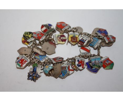 A SILVER AND ENAMEL CHARM BRACELET