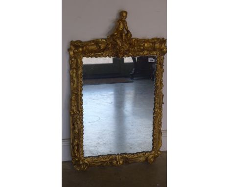 A Victorian carved wood gilded frame Italian Viennese wall mirror surmounted by a cherub - 93cm x 54cm 