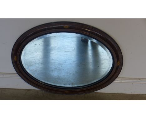 An Edwardian oval mirror with inlaid frame - 89cm x 65cm 