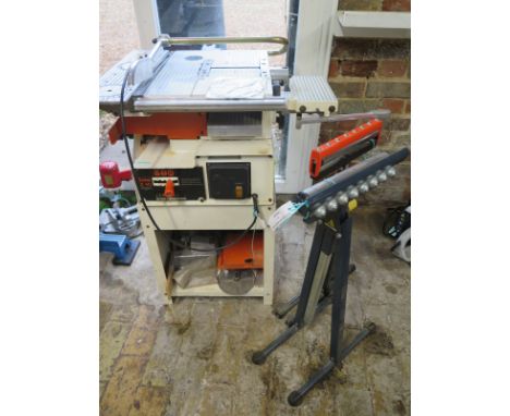 A Luna Z 40 electric woodworking machine with 2 roller stands 