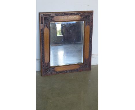 An early 20th century oak carved frame mirror - 70cm x 60cm 