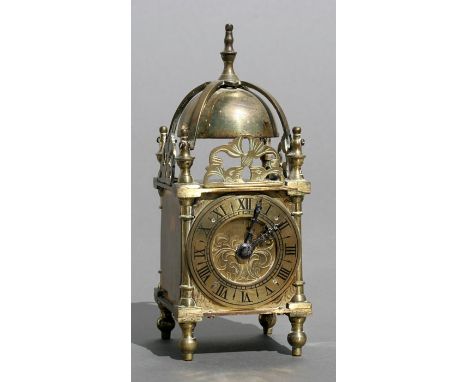 A 17th century style miniature brass lantern clock, 6.5cms (2.5ins) wide.