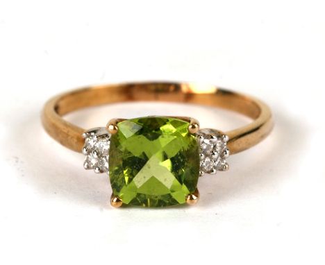 A 9ct gold ring set with a large green stone and diamond set shoulders, weight 2.5g, approx UK size 'R'.Condition Reportlarge