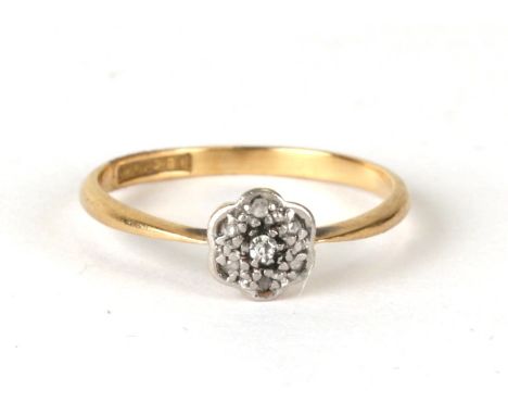 An 18ct gold &amp; platinum diamond daisy ring, weight 1.4g, approx UK size 'K'.