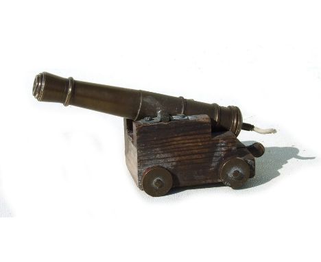 An unusual mid 20th century petrol lighter in the form of an 18th century Blomefield cannon, with a bronze barrel 11cms (4.25