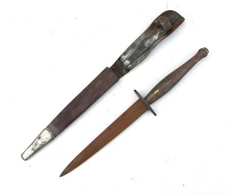 A Fairbairn Sykes commando type knife in a leather scabbard, 28.5cms (11.75ins) long.Condition ReportThe blade is extremely r