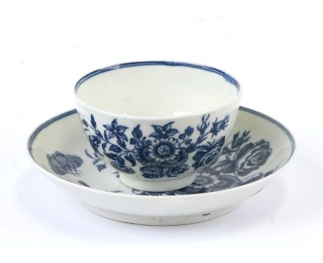 A Dr Wall First Period Worcester tea bowl and saucer decorated with flowers and butterflies, blue crescent mark to the unders