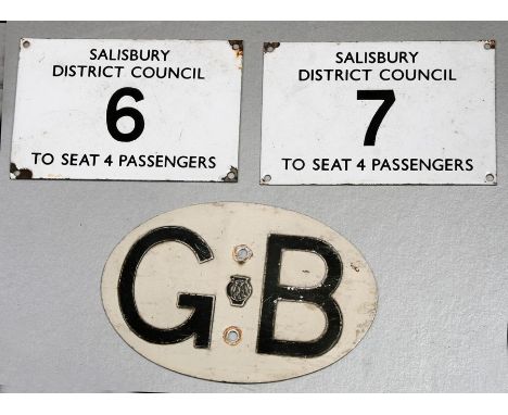 A Salisbury District Council enamel taxi licence plaque, No. 6 To Seat 4 Passengers, 10 by 15cms (4 by 6ins), another No. 7 a