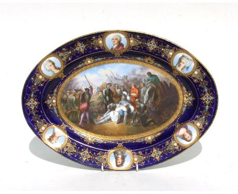 A Sevres oval porcelain cabinet plate, the central panel depicting Le Mort de Gaston de Foix en 1512 from the Bataille de Rav