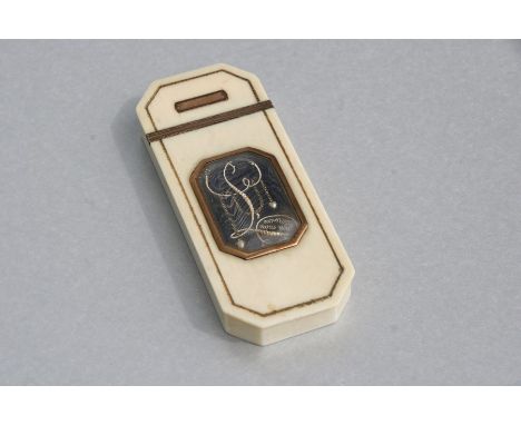 An 18th century French ivory yellow metal mounted snuff box of elongated octagonal form with blue enamel memorial panel to th