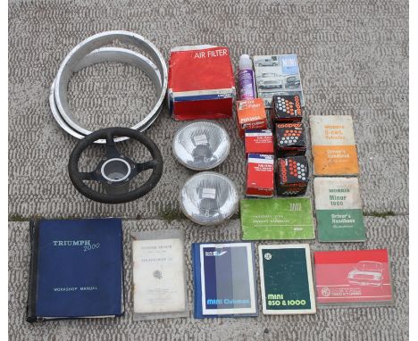 An autojumbler's lot comprising a three-spoke dished aluminium spoked steering wheel, 28cms (11ins) diameter, new old stock; 