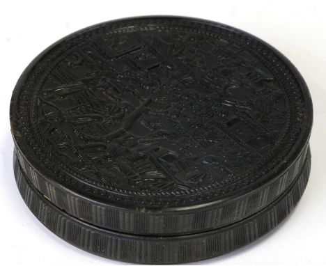 A Chinese tortoiseshell snuff box of compressed circular form, highly decorated with figures in a landscape, 10cms (4ins) dia