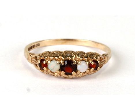 A 9ct gold opal and garnet five-stone ring, approx UK size 'M'.