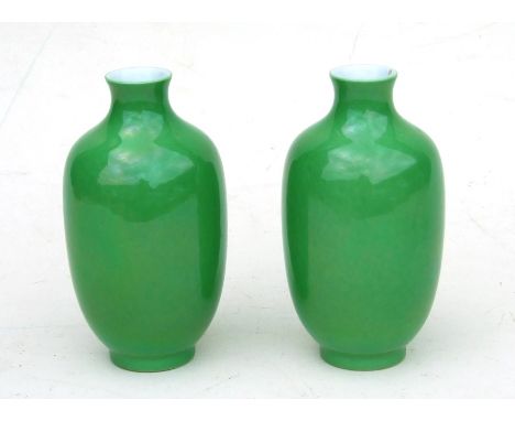 A pair of Chinese green monochrome vases with blue seal mark to the underside, 16cms (6.25ins) high.Condition ReportBoth in v