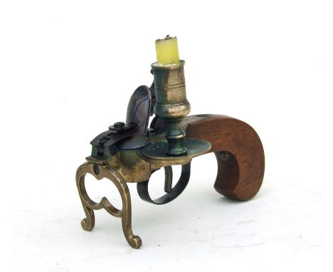 A flintlock pistol tinder table top lighter.