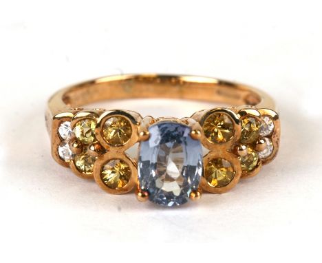 A 9ct gold dress ring set with coloured stones, possibly Topaz and citrine with diamonds, weight 5.2g, approx UK size 'R'.