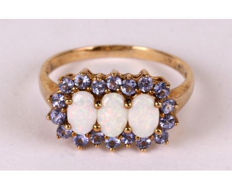 A 9ct gold opal and tanzanite ring, weight 3g, approx UK size 'R'.