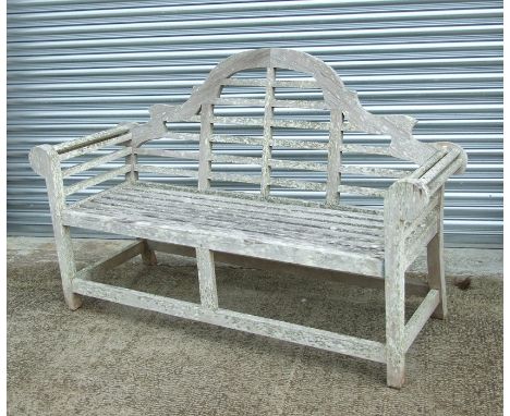 A well weathered teak Lutyen style garden bench, 170cms (67ins) wide.