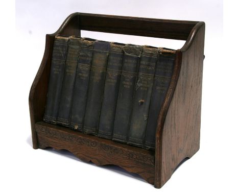 A set of 'The Children's Hour' children's stories, published by Waverley Book Co. Ltd, in an oak book trough, 36cms (14.25ins