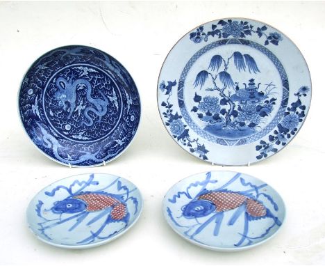 A Chinese blue &amp; white charger decorated with precious objects beside a tree, 32cms (12.5ins) diameter; together with a C