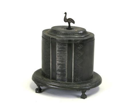 A sliver plated tea caddy of oval form, on ball &amp; claw feet with emu finial, 22cms (8.5ins) high.
