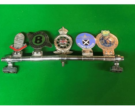 Five badge bar badges, for Bugatti Owners Club, Bentley Drivers Club, Royal Automobile Club Member, Ecure Ecosse, and BP Auto
