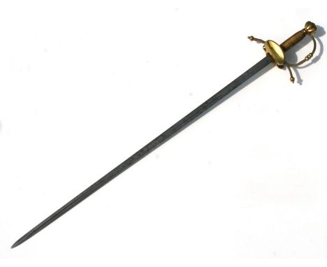 A Rapier type sword with brass hilt, the blade cut with single offset fullers, the hilt with down turned quillions, with bras