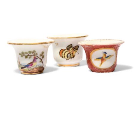 Three Paris porcelain rouge pots, c.1800-20, one painted with colourful birds on short branches, another with panels of birds