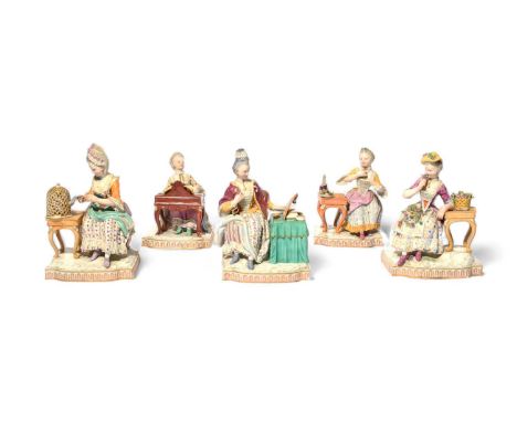 A set of Meissen figures of the Five Senses, late 19th/20th century, modelled by J C Schönheit, each as a young woman seated 