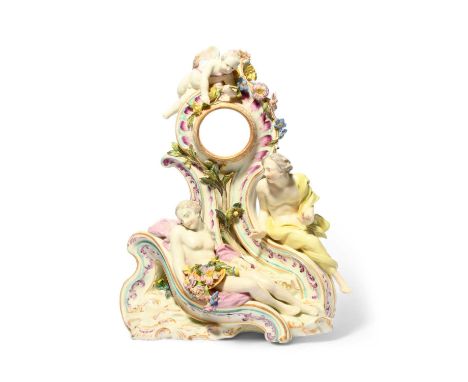 A rare Tournai Chelsea-decorated clock case, c.1760-65, modelled with Cupid above a sleeping maiden, watched by a figure drap