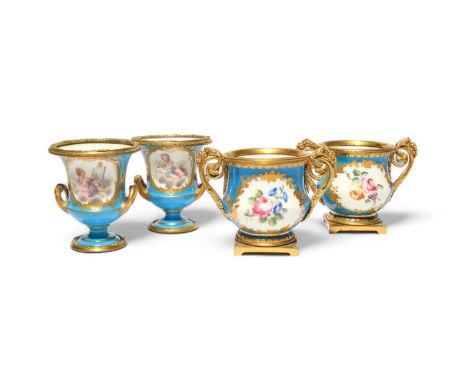 A pair of Sèvres ormolu-mounted small vases, 2nd half 18th century, painted with flower sprays within gilt foliate borders on