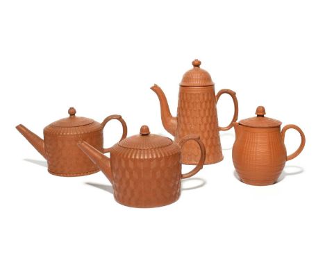 Two redware cylindrical teapots and covers, mid 18th century, a small coffee pot and cover, and a jug and cover, the coffee p