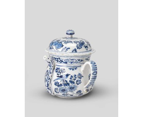 A large English delftware posset pot and cover, c.1720, London or Bristol, the large body painted in blue with birds perched 