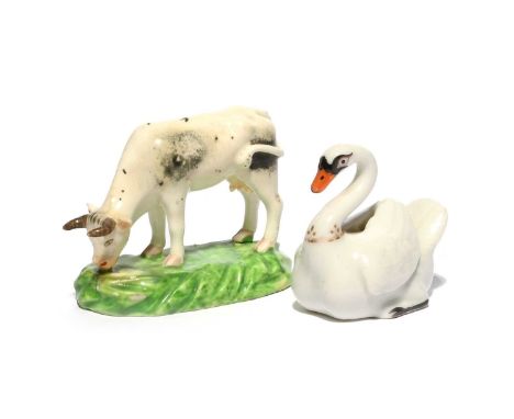A Chamberlain's Worcester figure of a swan, c.1810, modelled with wings folded across its back, red script mark, and a small 