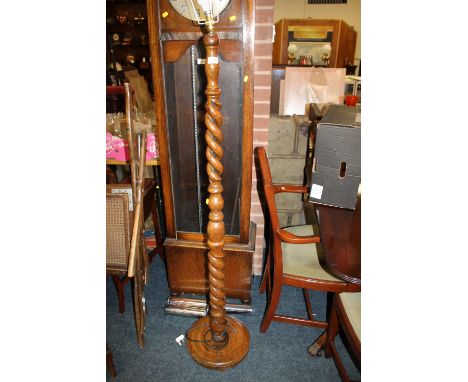 AN OAK OPEN BARLEYTWIST STANDARD LAMP