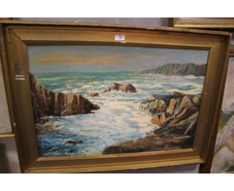 A LARGE GILT FRAMED OIL ON BOARD DEPICTING A SEASCAPE WITH WAVES CRASHING AGAINST ROCKS SIGNED W.E.MELBOURN
