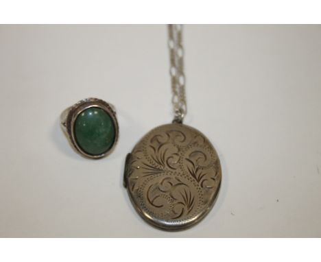 A LARGE HALLMARKED SILVER LOCKET TOGETHER WITH A DRESS RING SET WITH A GREEN STONE