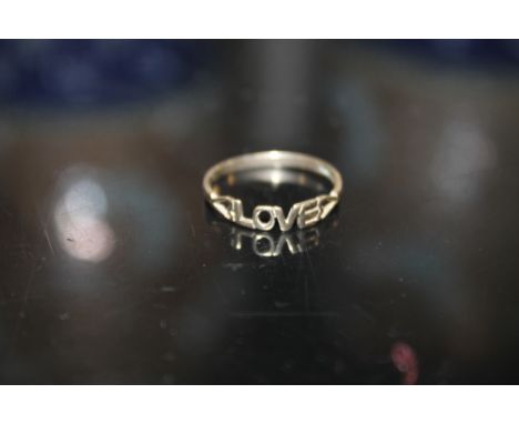 A 9CT GOLD LOVE RING