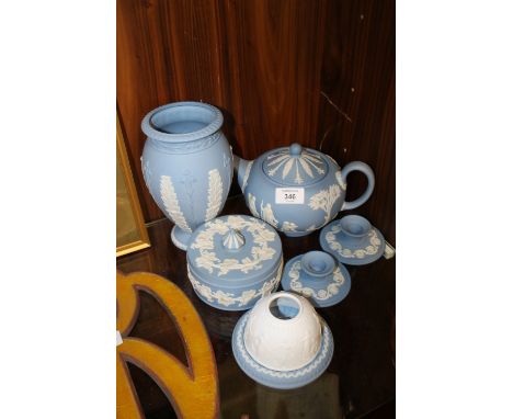 SIX PIECES OF WEDGWOOD JASPERWARE TO INCLUDE A TEAPOT, CANDLE HOLDER AND COVER ETC