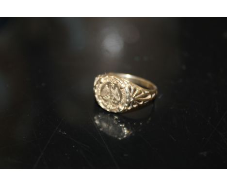 A 9CT GOLD SIGNET RING SET WITH MEXICAN COIN