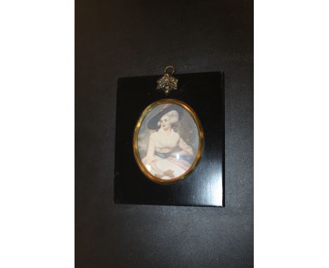 A SIGNED MINIATURE OVAL PORTRAIT OF A LADY 
