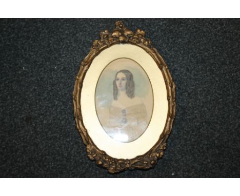 A SMALL GILT FRAMED PORTRAIT OF A LADY 