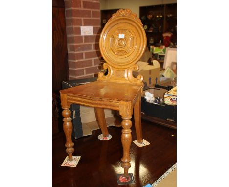 A 19TH CENTURY LIGHT OAK HALL CHAIR