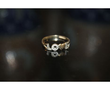 A 9CT GOLD LOVE RING