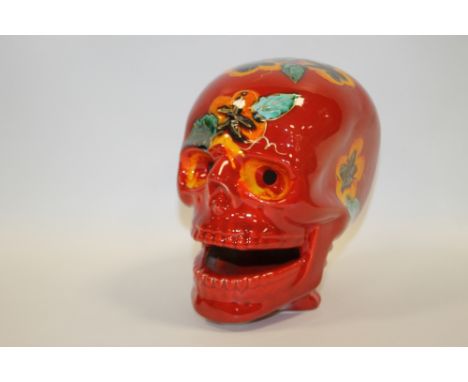A SIGNED ANITA HARRIS ART POTTERY FLORAL PATTERN CERAMIC SKULL 