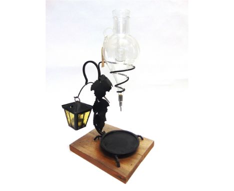 A SWISS WHITE WINE DECANTER  the amphora shaped glass body with a removable ice reservoir, on a metal stand with vine leaf de