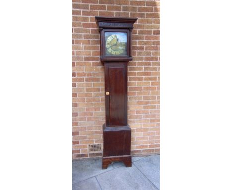 AN OAK CASED 30 HOUR LONGCASE CLOCK  the brass dial engraved with shipping scene to the centre, the Roman numeral chapter rin