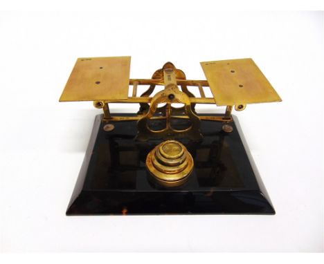 A SET OF SILVER AND TORTOISESHELL SCALES  hallmarked London 1917, together with four graduated weights, 19cm wide