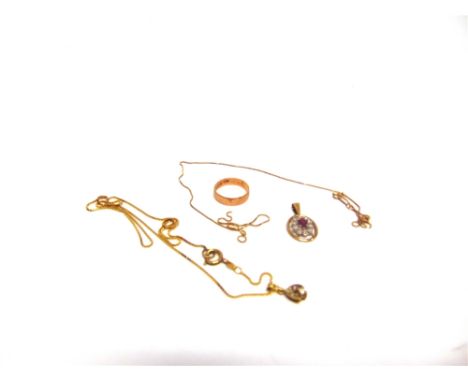 A 9 CARAT GOLD WEDDING RING a 9 carat gold ruby and diamond pendant; a 9 carat gold ruby and diamond pendant on a chain; and 